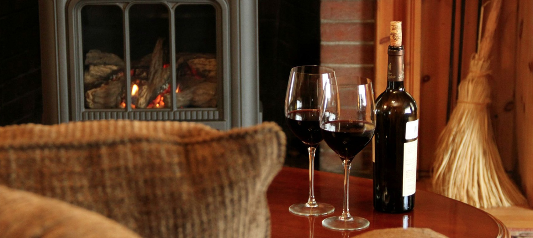 wine by fireplace